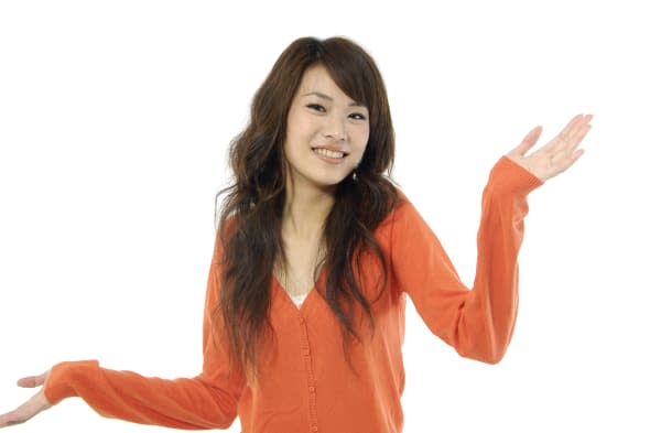 young asian woman shrugging her ...