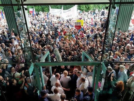 Supreme Court President Malgorzata Gersdorf addresses the supporters and the media before entering the Supreme Court building in Warsaw, Poland, July 4, 2018. REUTERS/Marcin Goclowski