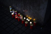 Candles placed at the Holocaust Memorial at the eve of the International Holocaust Remembrance Day in Berlin, Germany, Friday, Jan. 26, 2024. The International Holocaust Remembrance Day marking the anniversary of the liberation of the Nazi death camp Auschwitz - Birkenau on Jan. 27, 1945. (AP Photo/Markus Schreiber)