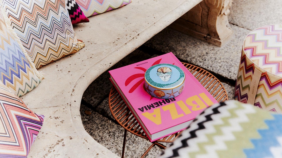 Missoni pillows and a colorful Assouline book from the Life category. - Credit: MyTheresa