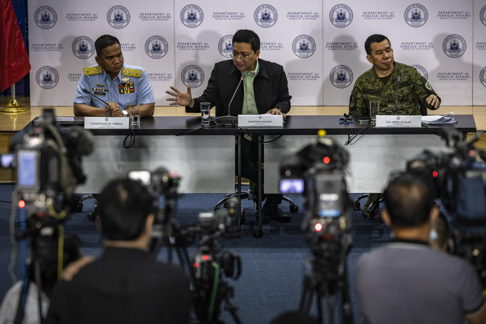 From left, Commodore Jay Tarriela, Philippine Coast Guard spokesperson for the West Philippine Sea, Jonathan Malaya, spokesperson for the National Security Council, and Col. Medel Aguilar, spokesperson for the Armed Forces of the Philippines, take part in a press conference on the recent actions by the Chinese Coast Guard against Philippine vessels in the South China Sea, at the Philippine Department of Foreign Affairs in Manila, Philippines on Monday, Aug. 7, 2023. The Philippine government summoned the Chinese ambassador on Monday to convey a diplomatic protest over the Chinese coast guard's use of a water cannon against a Filipino supply boat in the disputed South China Sea, a Philippine official said. (Ezra Acayan/Pool Photo via AP)