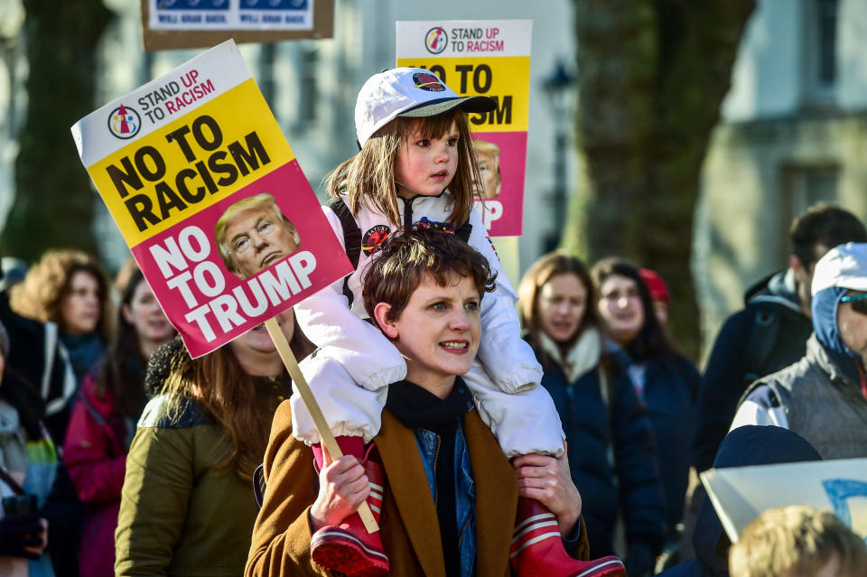 A young girl on the shoulders of a woman in Bristol in a march to promote women's rights in the wake of the US election result.&nbsp;