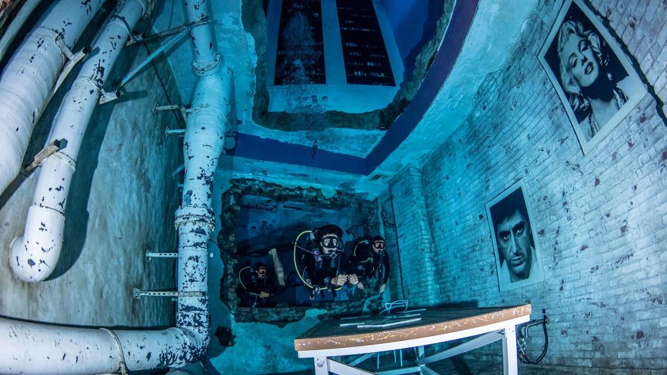 Divers at 30m in the sunken city at 12 Deep Dive Dubai