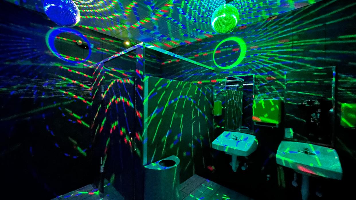 When you get to one of their disco bathrooms, you will see a red button with a sign that tells you to not push the red button which, of course, you will press. Afterward, you will enjoy the potty while listening to a funky song and surrounded by colored lights and a disco ball.