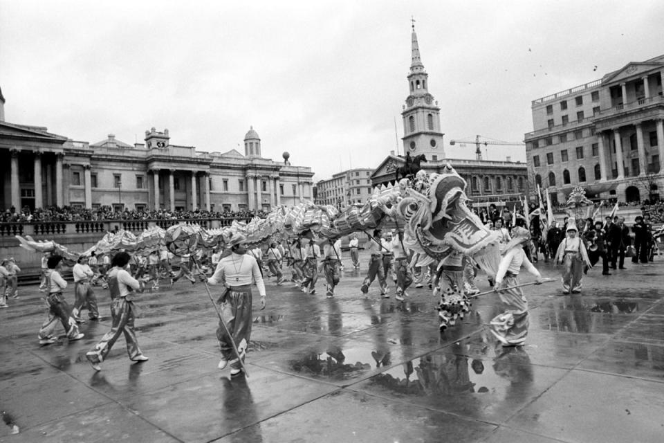 The scene in London's Trafalgar Square during the 1977 Chinese New Year celebrations to welcome in the Year of Snake. The 140ft dragon, made in Hong Kong, travelled from Trafalgar Square to Soho (PA)