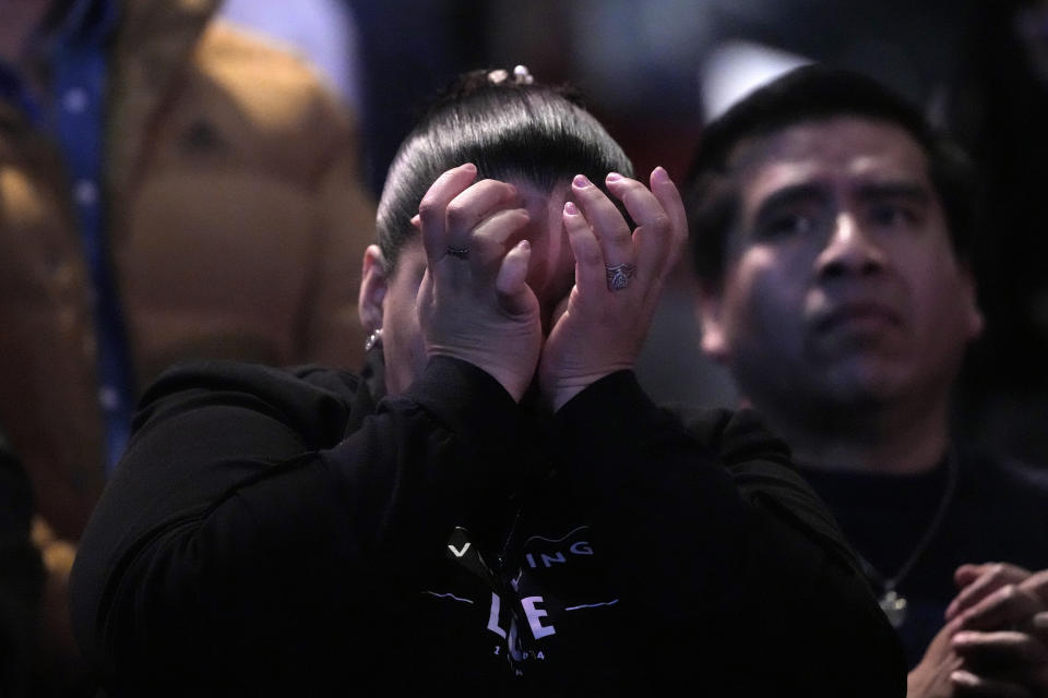 A churchgoer wipes away tears during a service at Lakewood Church Sunday, Feb. 18, 2024, in Houston. Pastor Joel Osteen on Sunday welcomed worshippers back to Lakewood Church for the first time since a woman with an AR-style opened fire in between services at his Texas megachurch last Sunday. (AP Photo/David J. Phillip)