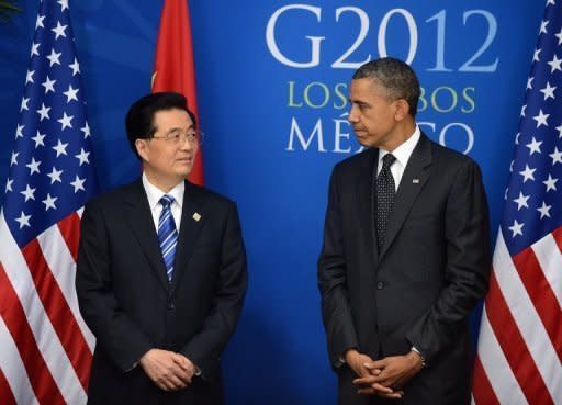 US President Barack Obama (R) with Chinese President Hu Jintao before a bilateral meeting in Los Cabos, Mexico, on June 19, on the sidelines of the G20 summit. After years of pressure to take a greater role in global affairs, China and India have stepped up by contributing to a new IMF emergency fund -- from which the United States is absent