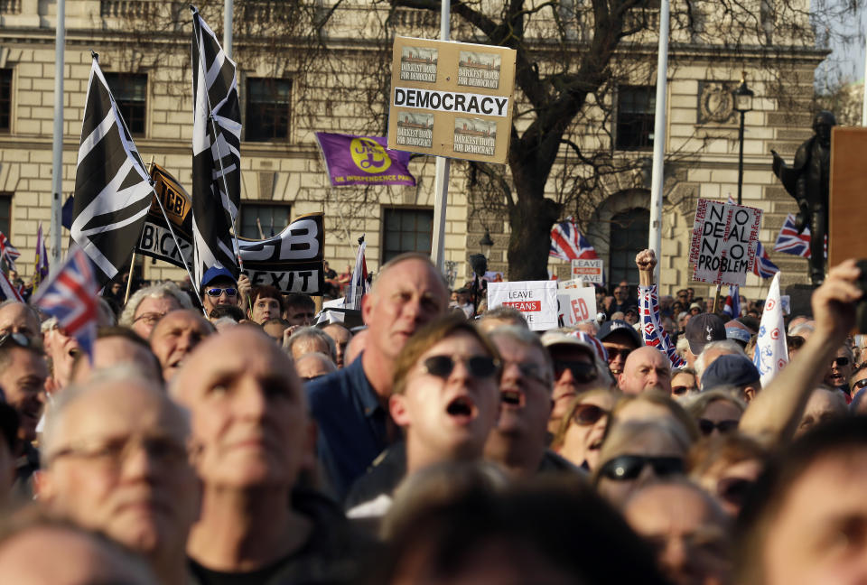 Pro-Brexit leave the European Union supporters attend a rally in Parliament Square after the final leg of the "March to Leave" in London, Friday, March 29, 2019. The protest march which started on March 16 in Sunderland, north east England, finishes on Friday March 29 in Parliament Square, London, on what was the original date for Brexit to happen before the recent extension. (AP Photo/Tim Ireland)