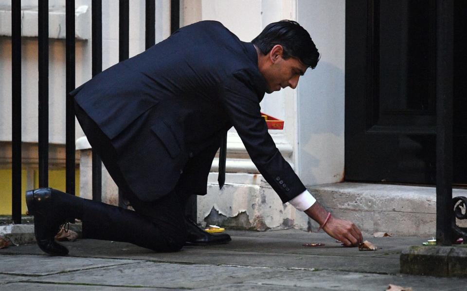 Then-Chancellor Sunak lights a candle for Diwali in Downing Street, November 2020 - Getty