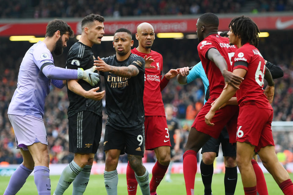 Arsenal's Granit Xhaka (second from left) is held back as he argues with Liverpool's Trent Alexander-Arnold (right) during their English Premier League clash at Anfield. 