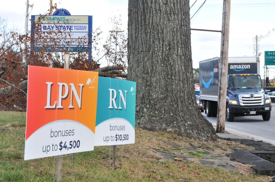 Signs advertise open jobs for licensed practical nurses and registered nurses at Wedgemere Healthcare, 146 Dean St. in Taunton, on Monday, Jan. 10, 2022.