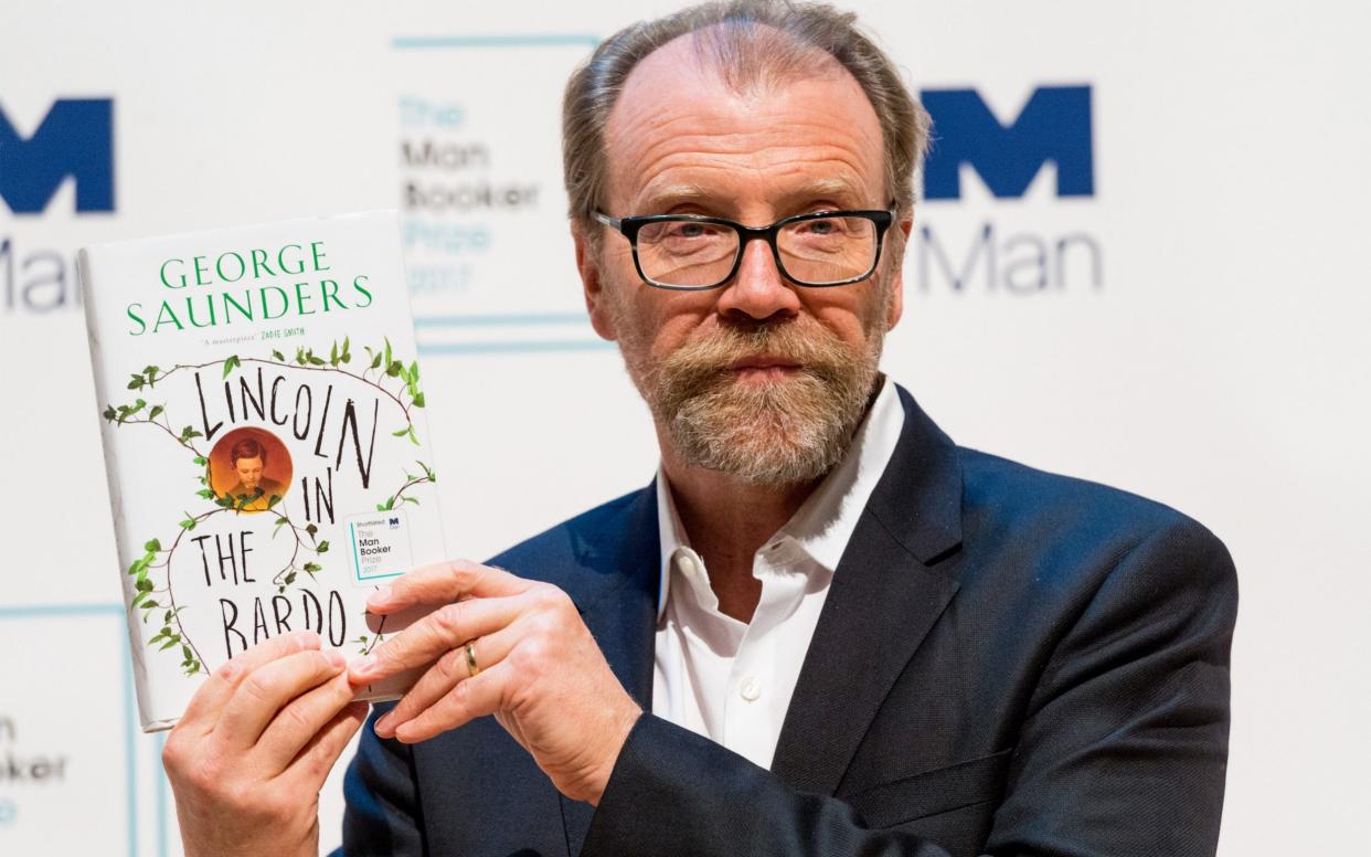 George Saunders with his book Lincoln in the Bardo - Barcroft Media