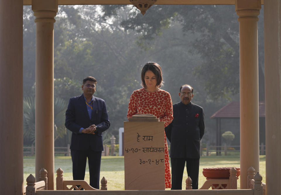 German Foreign Minister Annalena Baerbock, pays her respects at the Gandhi Smriti, a place where Mahatma Gandhi spent the last days of his life and was assassinated, in New Delhi, Monday, Dec. 5, 2022. Baerbock is on a two days official visit to India. (AP Photo/Manish Swarup)