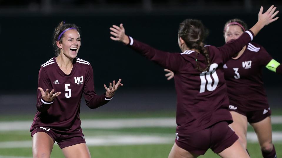 Walsh Jesuit junior Hannah Pachan, facing, celebrates her second goal of the night to take the lead against Strongsville in the second half of a Division I state semifinal, Tuesday, Nov. 7, 2023.