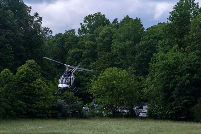 <p>Nicole Hester / The Tennessean</p> A helicopter takes flight near where three people died in a plane crash in Tenn.