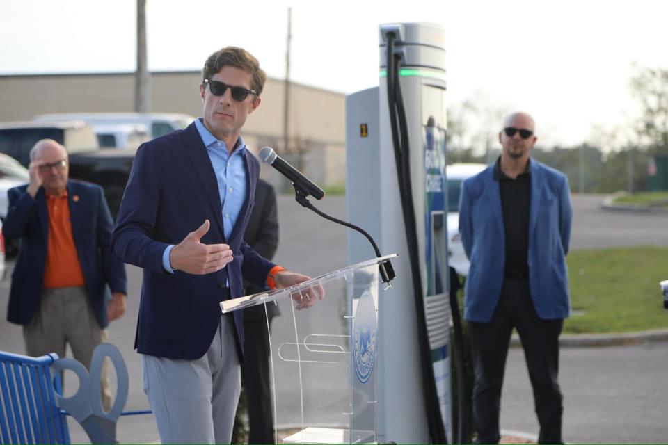 Mayor Chaz Molder speaks on Tuesday, Sept. 24, 2024 at the unveiling of the city's newest fast charging electric vehicle station located at the intersection of East 7th and Woodland Streets.