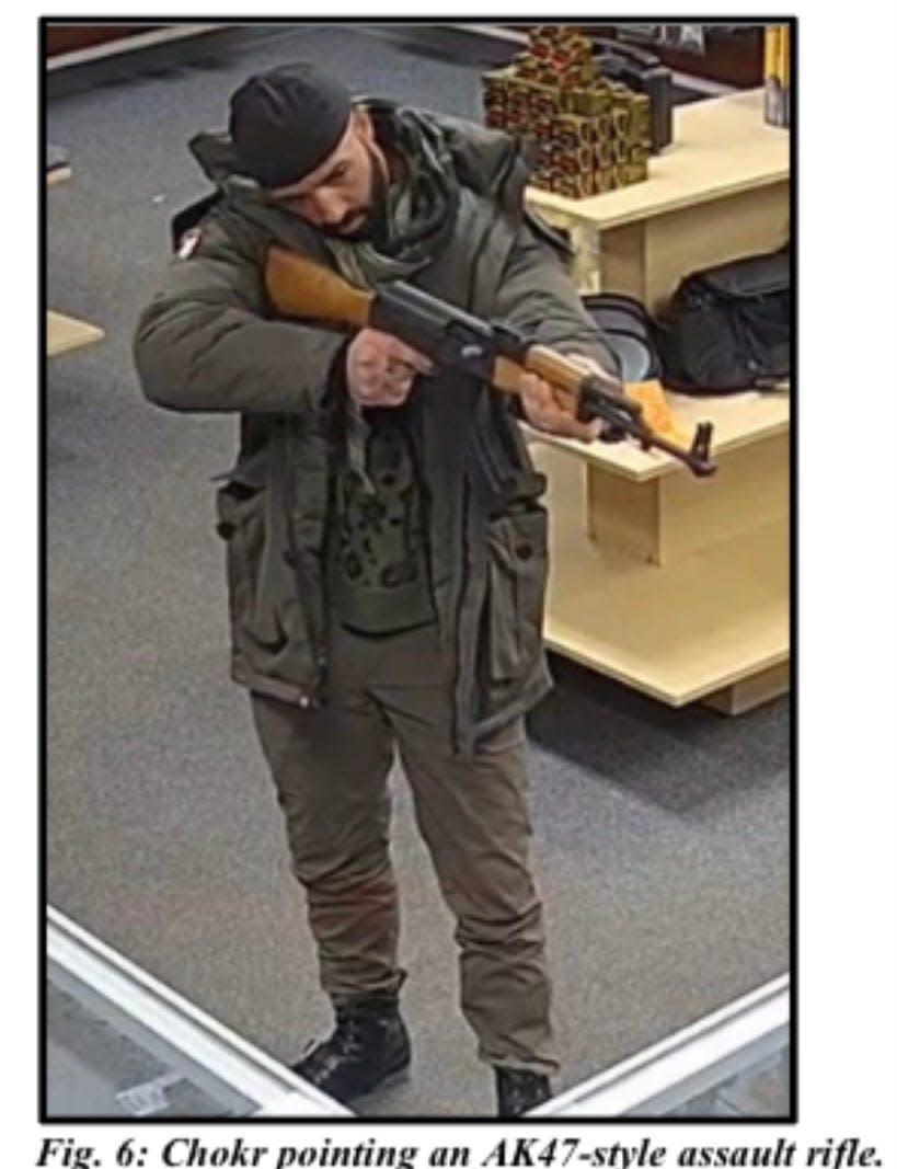 Hassan Chokr, 35, of Dearborn, is seen trying out an AK47-style assault rifle at Dearborn Outdoors, a gun store in Dearborn, on Dec. 2, 2022. Prosecutors said he visited the store to attempt to buy guns after he drove that morning to a synagogue in Bloomfield Township, yelling slurs at Jewish children and parents. He's been charged by both county and federal prosecutors in the antisemitic incident that has drawn national attention.