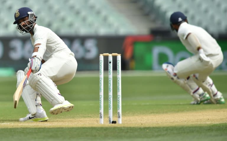 Crucial partnership: Ajinkya Rahane (left) and Cheteshwar Pujara put on 87 as India extended their lead towards 300 during the first session of the fourth day in Adelaide