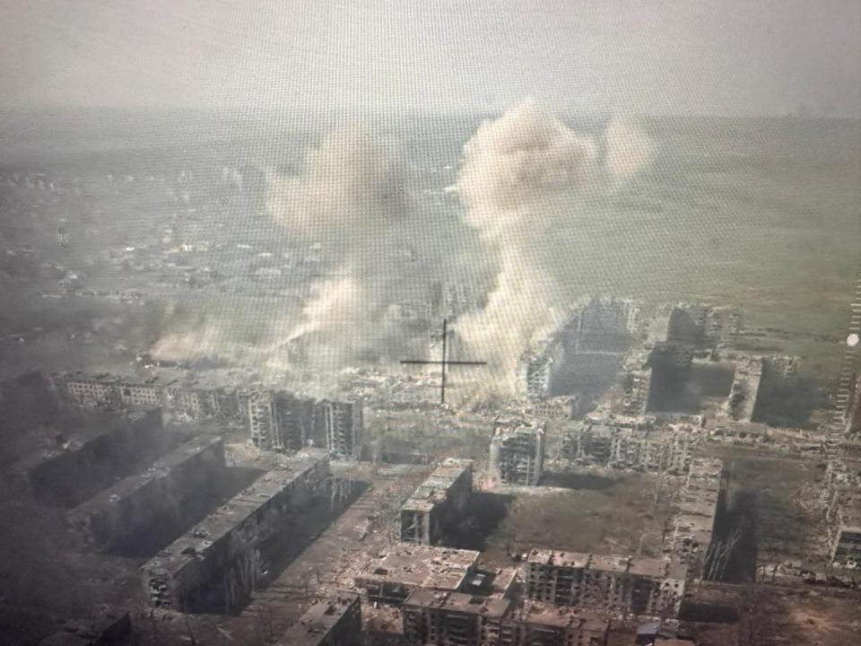 An aerial view of smoke rising over Bakhmut, showing what Yuriy Stetskiv identifies as a missed Russian strike on their command post.