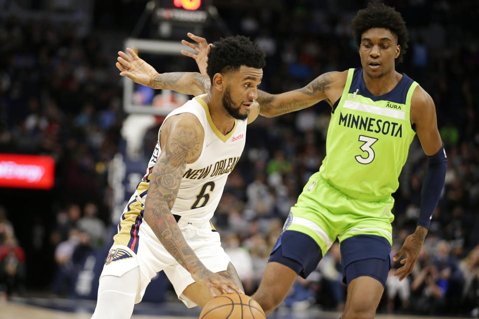 New Orleans Pelicans guard Nickeil Alexander-Walker (6) drives against Minnesota Timberwolves forward Jaden McDaniels (3) in the first half of an NBA basketball game, Saturday, Oct. 23, 2021, in Minneapolis. (AP Photo/Andy Clayton-King)