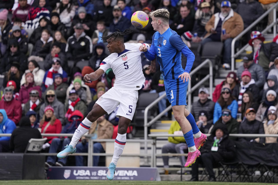 United States defender DeJuan Jones (5) and Slovenia defender Srdan Kuzmic (3) battle for a header during the first half of an international friendly soccer match in San Antonio, Saturday, Jan. 20, 2024. (AP Photo/Eric Gay)