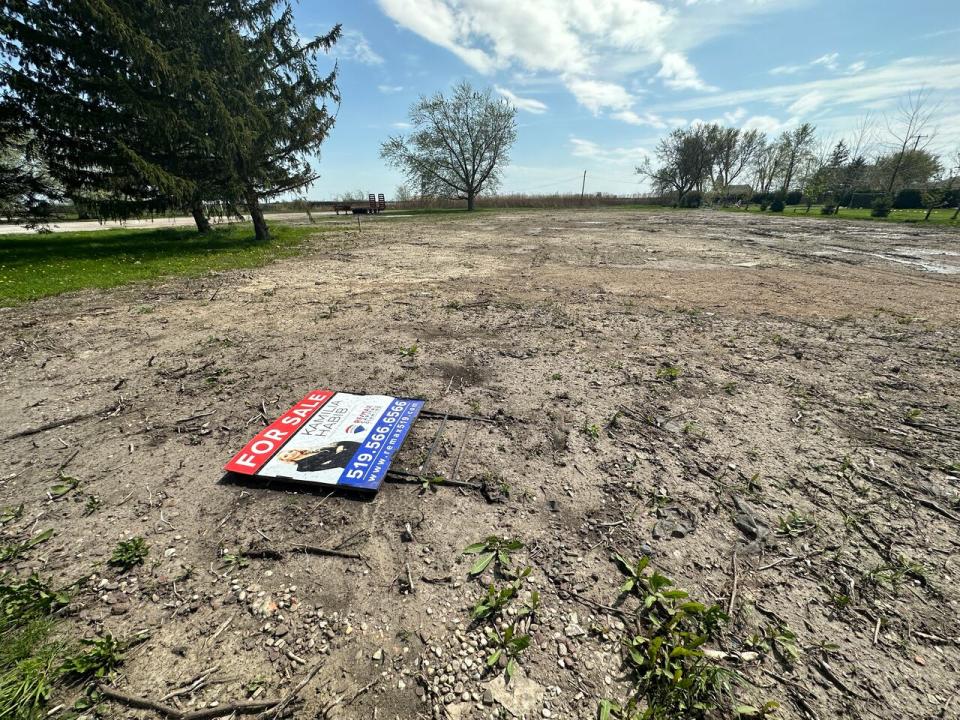 A for sale sign sits on the ground at the site of the former Annunciation Church. (Dale Molnar/CBC - image credit)