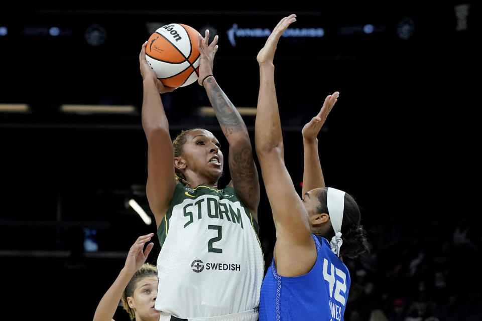 Seattle Storm center Mercedes Russell (2) shoots over Connecticut Sun forward Brionna Jones (42) during the first half of the Commissioner's Cup WNBA basketball game Thursday, Aug. 12, 2021, in Phoenix. (AP Photo/Matt York)