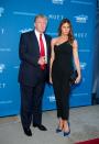 <p>Still favouring the flattering look of a tailored jumpsuit, Melania wore a tight-fitting style with blue Louboutins for a gala. <i>[Photo: Getty]</i> </p>