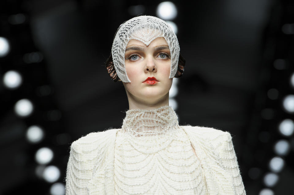 A model wears a design from the Bora Aksu collection during London Fashion Week, Friday, Feb. 15, 2013, in London. (Photo by Jonathan Short/Invision/AP)