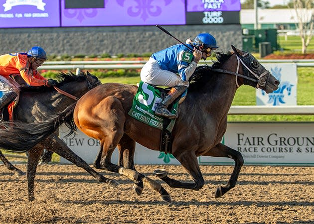 Catching Freedom and jockey Flavien Prat win the Louisiana Derby on March 23 at Fair Grounds.