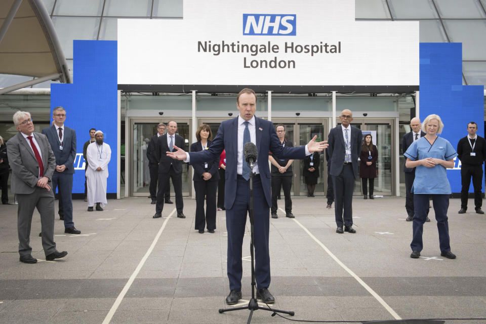 Britain's Health Secretary Matt Hancock delivers a speech at the opening of the NHS Nightingale Hospital at the ExCel centre in London, Friday April 3, 2020. Prince Charles remotely opened on Friday the new Nightingale Hospital at London’s main exhibition and conference center, a temporary facility that will soon be able to treat 4,000 people who have contracted the COVID-19 virus. (Stefan Rousseau/Pool Photo via AP)