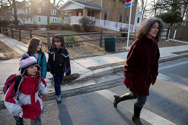 Danielle Meitiv, right, walks home with her daughter Dvora Meitiv, 6, left, Rosie Resnick, 9, and her son Rafi Meitiv, 10, after being dropped off from school. Photo: Getty
