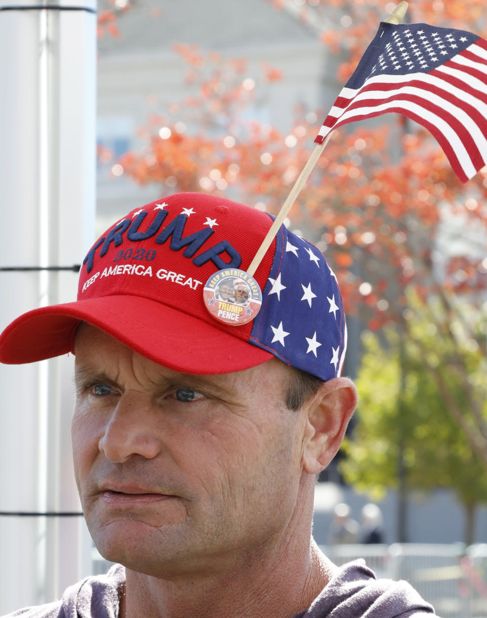 David Staser of Pontotoc, Miss., sports a hat supporting President Donald Trump, outside the BancorpSouth Arena in Tupelo, Miss., Friday, Nov. 1, 2019, before a Keep America Great Rally. (AP Photo/Rogelio V. Solis)