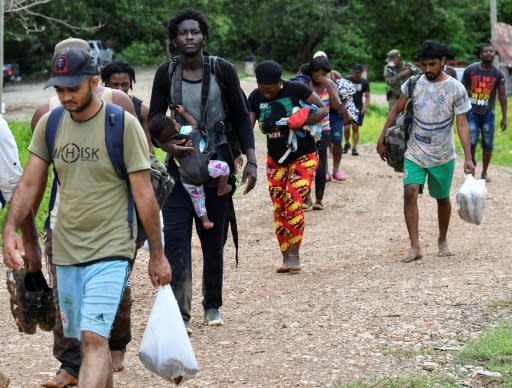 Haitian migrants arrive in Lajas Blancas, Darien province, Panama, on May 22, 2019, after walking through the jungle