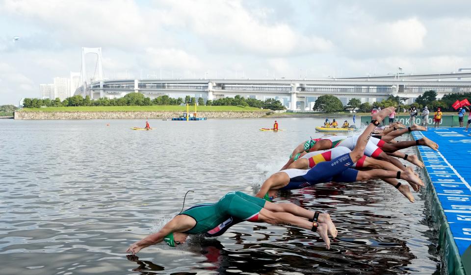 The triathlon begins following a false start (Martin Rickett/PA) (PA Wire)