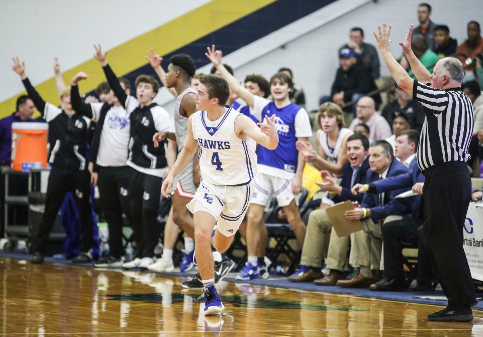 LaRue County's Carson Childress celebrates after scoring three against George Rogers Clark Monday's King of the Bluegrass in Fairdale. Dec. 19, 2022 