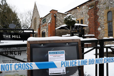 Police tape is seen in front of a pub which was visited by former Russian intelligence officer Sergei Skripal and his daughter Yulia before they were found on a park bench after being poisoned in Salisbury, Britain, March 19, 2018. REUTERS/Peter Nicholls