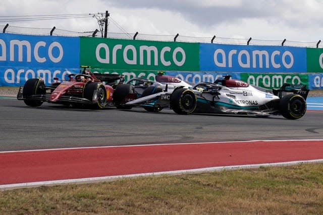 Carlos Sainz (left) is spun by George Russell