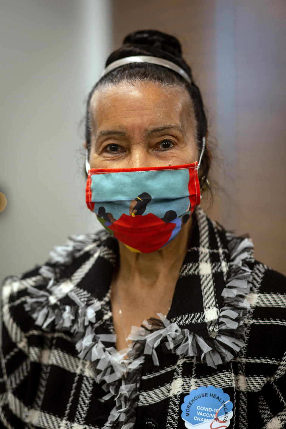 Civil rights leader Xernona Clayton is shown after receiving her COVID-19 vaccination on Tuesday, Jan. 5, 2021, at the Morehouse School of Medicine in Atlanta. Clayton, baseball great Hank Aaron and others hoped to highlight the importance of getting vaccinated for Black Americans who might be hesistant to do so. (AP Photo/Ron Harris)