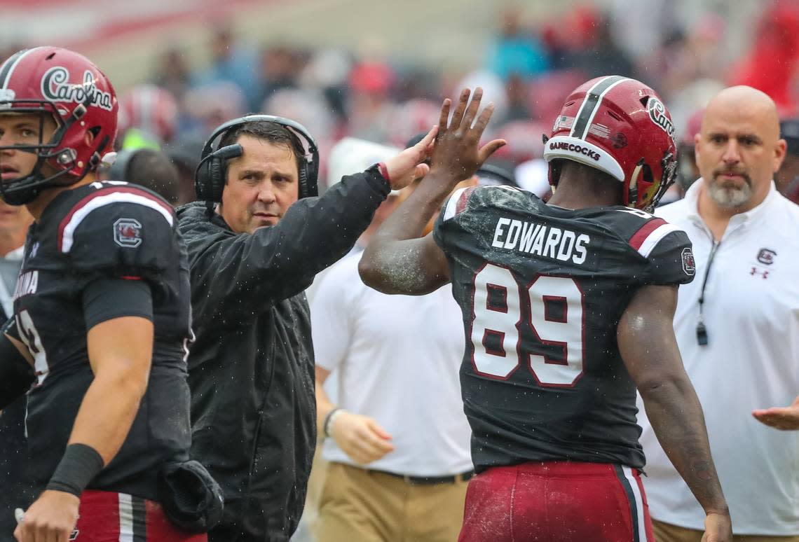 South Carolina head coach Will Muschamp congratulates South Carolina wide receiver Bryan Edwards (89) on a touchdown against Akron at Williams-Brice Stadium on Dec. 1, 2018.