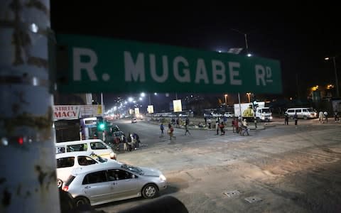 A street scene along Robert Mugabe road in Harare - Credit: AP