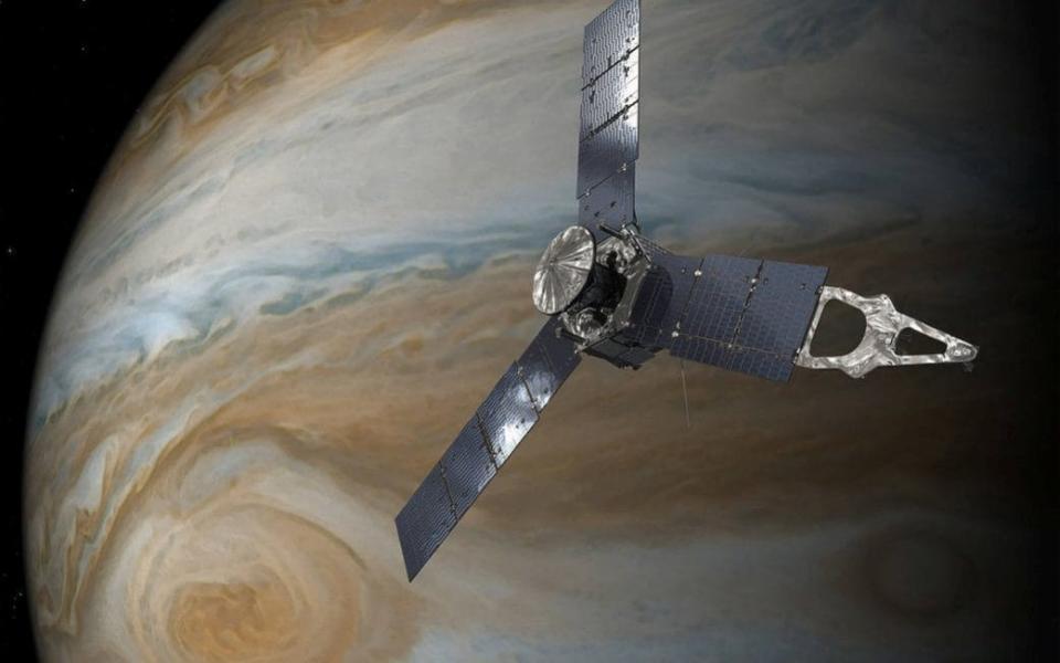 An illustration of NASA's Juno spacecraft in orbit above Jupiter's Great Red Spot - Credit: NASA/Reuters