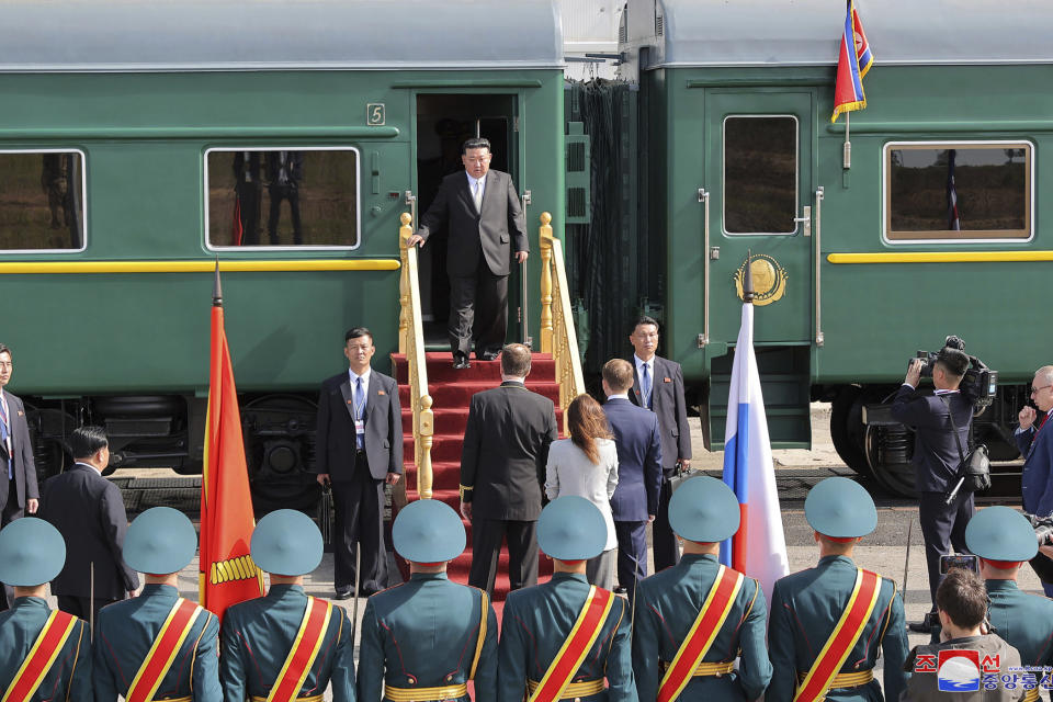 In this photo provided by the North Korean government, North Korean leader Kim Jong Un, center, arrives at the Vostochny cosmodrome outside the city of Tsiolkovsky, about 200 kilometers (125 miles) from the city of Blagoveshchensk in the far eastern Amur region, Russia, Wednesday, Sept. 13, 2023. Independent journalists were not given access to cover the event depicted in this image distributed by the North Korean government. The content of this image is as provided and cannot be independently verified. Korean language watermark on image as provided by source reads: "KCNA" which is the abbreviation for Korean Central News Agency. (Korean Central News Agency/Korea News Service via AP)