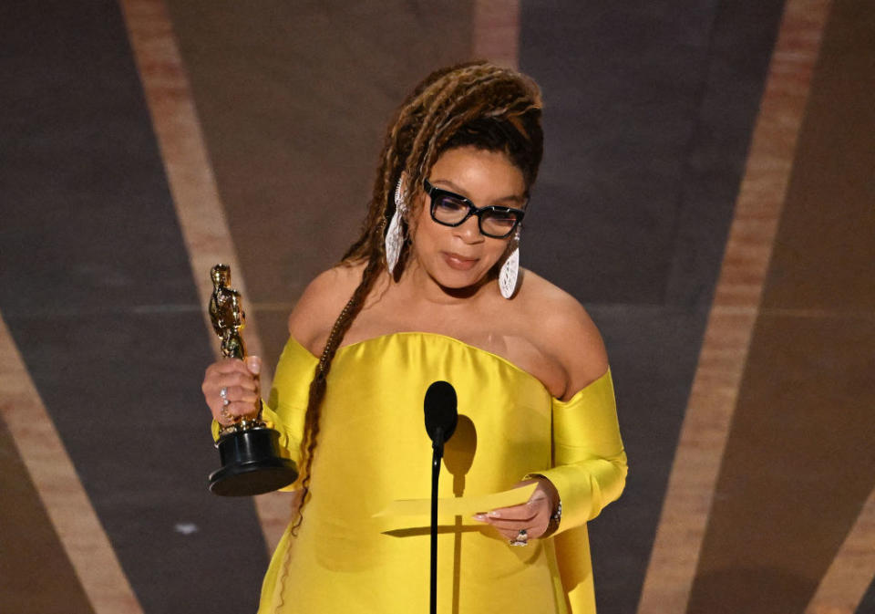 Ruth E. Carter accepts the Oscar for Best Costume Design for "Black Panther: Wakanda Forever" onstage