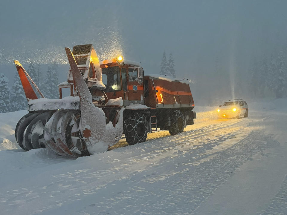 This Saturday, Dec 31, 2022, photo released by Caltrans District 3, California Department of Transportation crews clear the road on Highway 50 over Echo Summit for avalanche control work in South Lake Tahoe, Calif. Highway 50 is now back open to traffic. Interstate 80 remains closed. California was drying out and digging out on Sunday, Jan. 1, 2023, New Year's Day after a powerful storm brought drenching rain or heavy snowfall to much of the state, snarling traffic and closing highways. (Caltrans District 3 via AP)