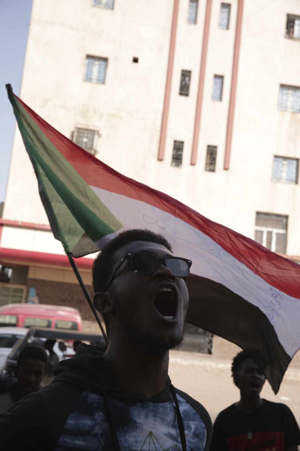 People chant slogans during a protest in Khartoum, amid ongoing demonstrations against a military takeover in Khartoum, Sudan, Thursday, Nov. 4, 2021. (AP Photo/Marwan Ali)