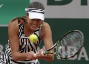 Tennis - French Open - Roland Garros - Kumuri Nara of Japan v Ana Ivanovic of Serbia - Paris, France - 26/05/16. Ivanovic returns a shot. REUTERS/Jacky Naegelen