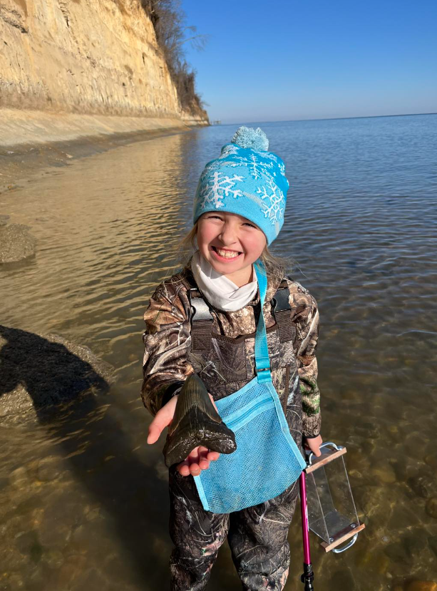 Molly Sampson, 9, was on a Christmas Day visit to Calvert Beach in Maryland, when she found a 5-inch tooth belonging to the now-extinct Otodus megalodon shark species.