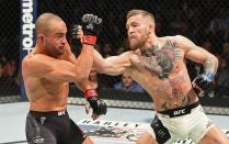 <p>Eddie Alvarez of the United States (left) fights against Conor McGregor of Ireland in their lightweight championship bout during the UFC 205 event at Madison Square Garden on November 12, 2016 in New York City. (Photo by Jeff Bottari/Zuffa LLC/Zuffa LLC via Getty Images) </p>