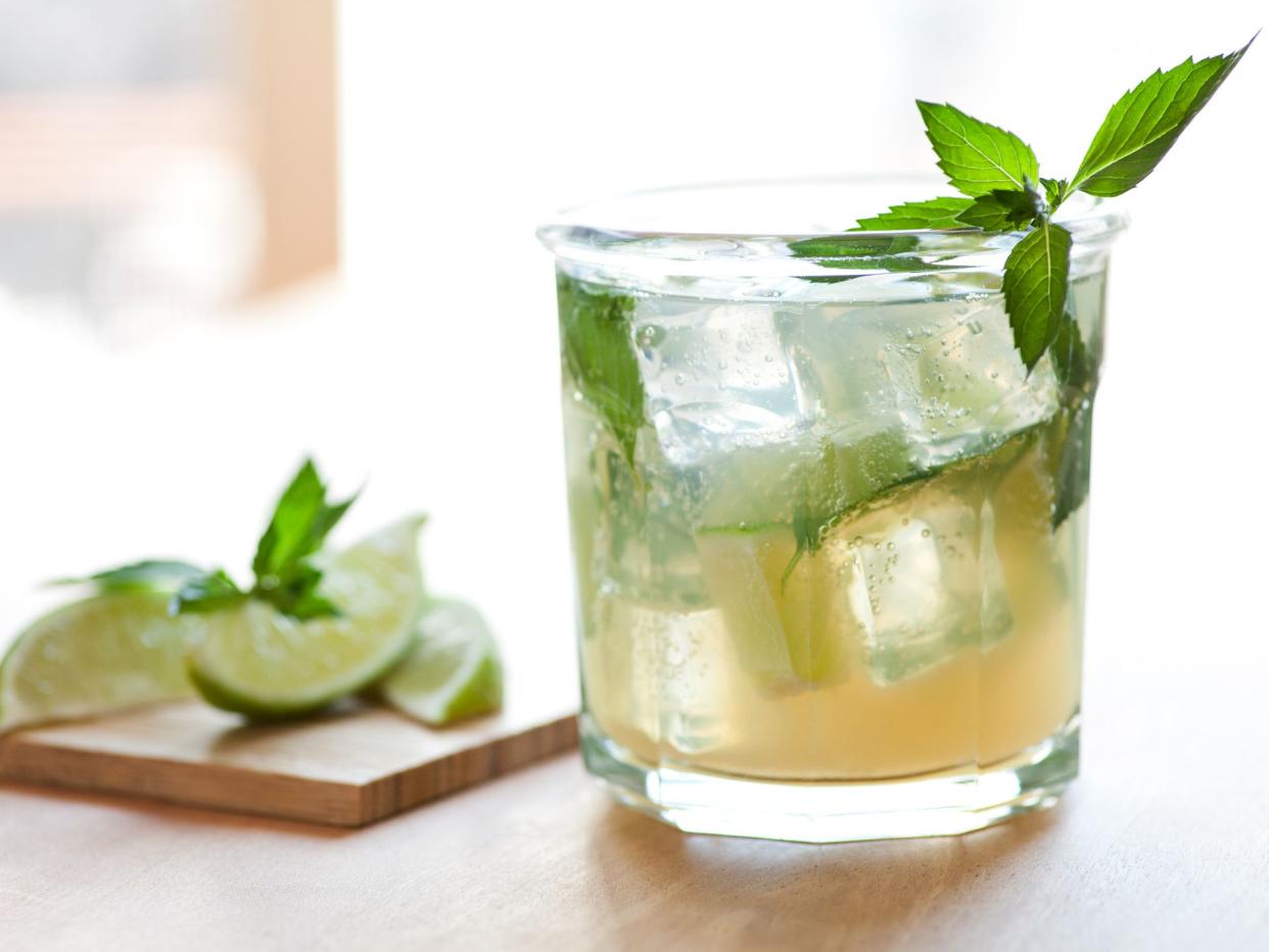 Mojito garnished with mint and limes.